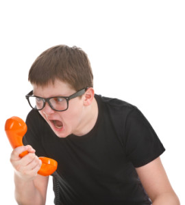 angry kid screams into the telephone